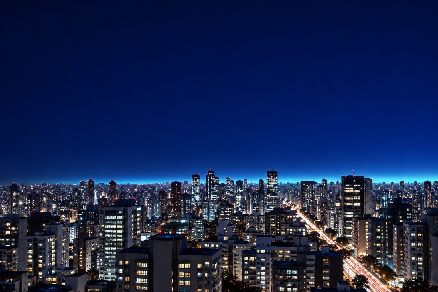 A mesma vista de São Paulo, já à noite, com mais janelas acesas